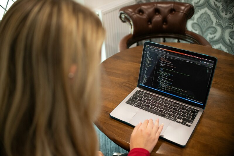 Blonde woman coding